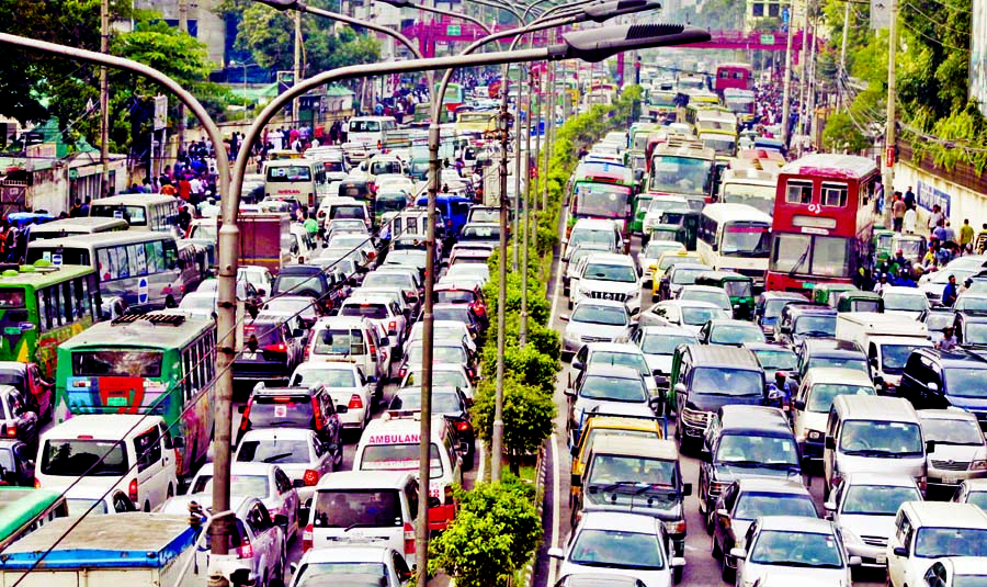 Thousands of vehicles got stuck at a missive gridlock in city due to RMG workers' road blockade and regular road digging, causing sufferings to commuters on Monday.