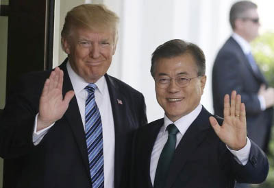 US President Donald Trump (L) welcomes South Korean President Moon Jae-in at the White House in Washington.
