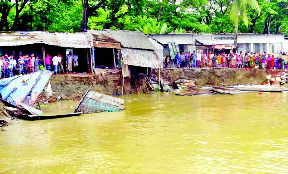 Local people passing days in anxiety as Kirtankhola river bank continues to erode and devouring homesteads, market and schools at Charkawa area in Barisal. This photo was taken on Monday.