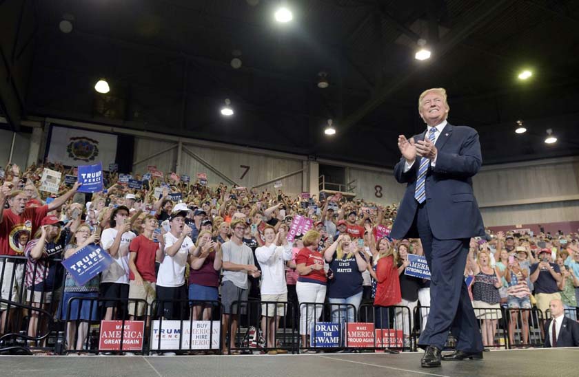 President Donald Trump arrives to speak at a campaign-style rally at Big Sandy Superstore Arena in Huntington.