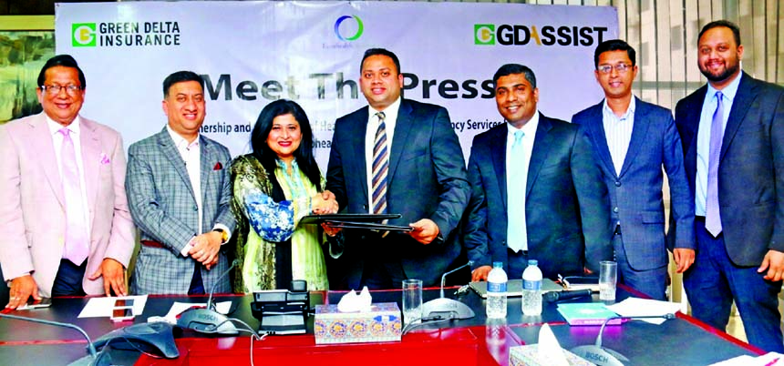 Farzana Chowdhury, Managing Director of Green Delta Insurance and Director of GD Assist and Hanie Abdul Sathar, Director of Eurohealth Systems, exchanging an agreement signing documents in the city on Tuesday. Under the deal, Eurohealth Systems will provi