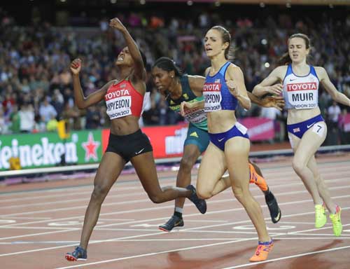 Kenya's Faith Chepngetich Kipyegon (left) celebrates after winning the gold medal when crossing the line ahead of South Africa's Caster Semenya, bronze, and United States' Jennifer Simpson, silver and Britain's Laura Muir (right) in the women's 1500-