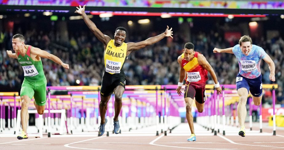 Jamaica's Omar Mcleod, second left, celebrates as he wins the gold medal in the final of the Men's 110m hurdles during the World Athletics Championships in London on Monday. At right Russia's Sergey Shubenkov, who took silver and at left Hungary's Bal