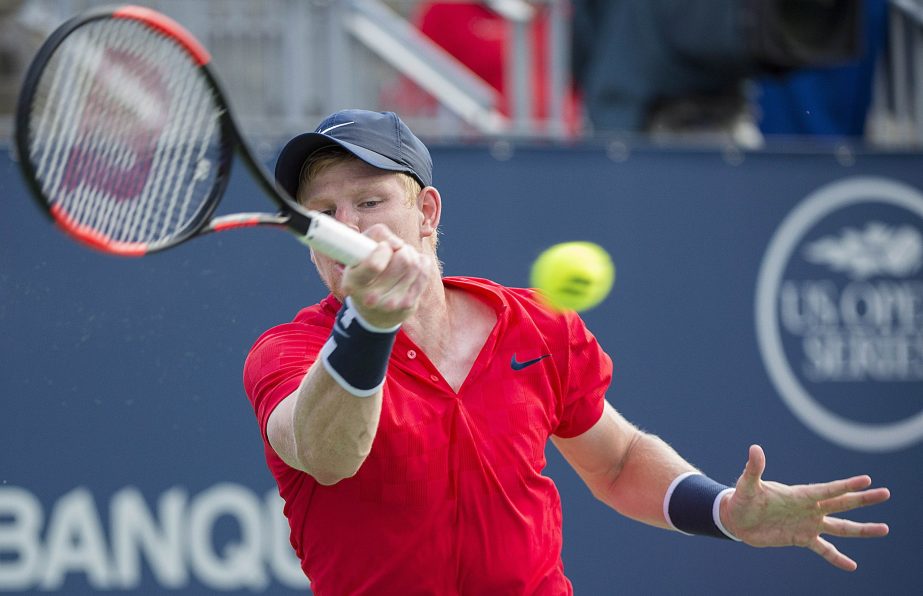 Kyle Edmund of Britain, plays a shot to David Ferrer, of Spain during their first-round match at the Rogers Cup tennis tournament in Montreal on Monday.