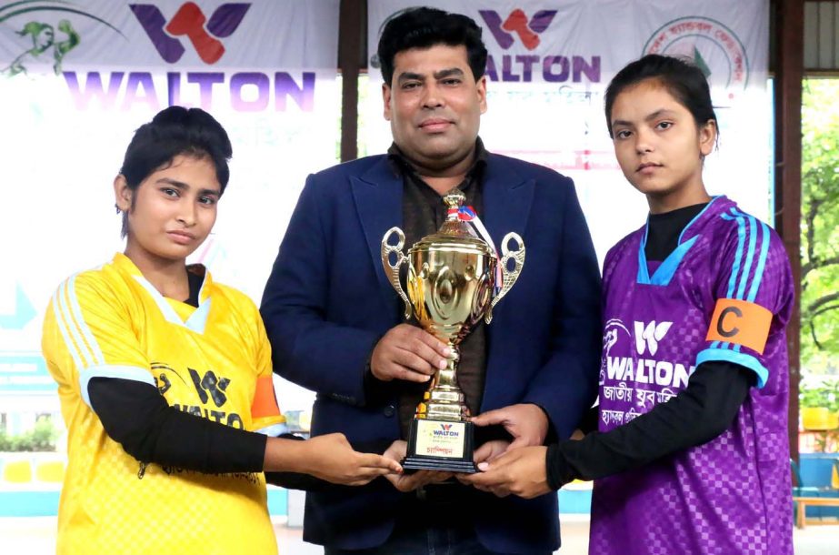 Walton Group operative director and head of games & sports FM Iqbal Bin Anwar pose with the captains of Jamalpur DSA and Noagaon DSA at the national Handball Stadium on Wednesday.