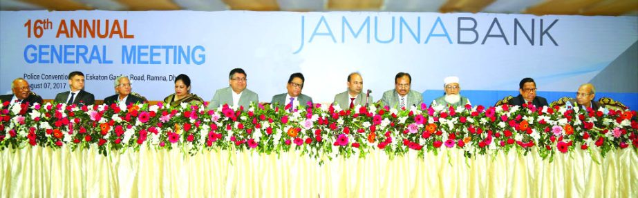 Md. Ismail Hossain Siraji, Chairman, Board of Directors of Jamuna Bank Limited, presiding over its 16th AGM at a city convention center on Monday. The AGM approved 20.50 percent cash dividend for the year 2016 for its shareholders. Shafiqul Alam, Managing