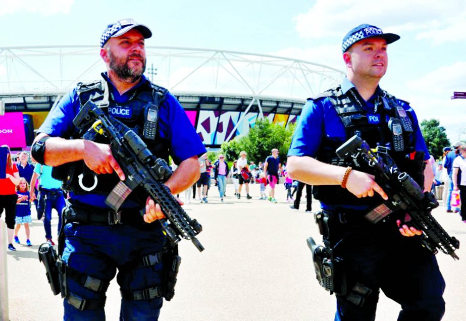 Police officers patrol in front of London Stadium during World Athletics Championships.