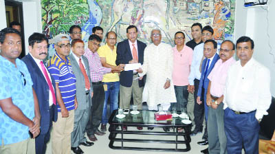 KHULNA: SM Amzad Hossain, Chairman, South Bangla Agriculture & Commerce (SBAC) Bank Ltd handing over the cheque of Tk. 5 lakh to the office-bearers of Khulna Press Club on Sunday