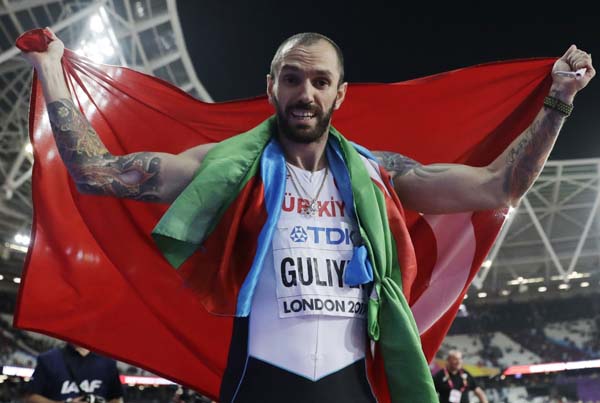 Turkey's Ramil Guliyev celebrates after winning the gold medal in the men's 200-meter final during the World Athletics Championships in London on Thursday.