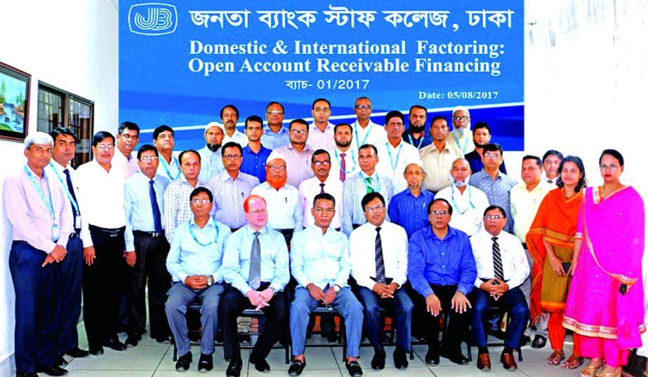 Abdus Salam Azad, DMD of Janata Bank Ltd, poses with the participants of a day- long training course at the bank's Staff College in the city on Thursday. Prosanto Kumar Benerjje, Director of Bangladesh Institute of Bank Management, Hossain Yeahia Chowdhu