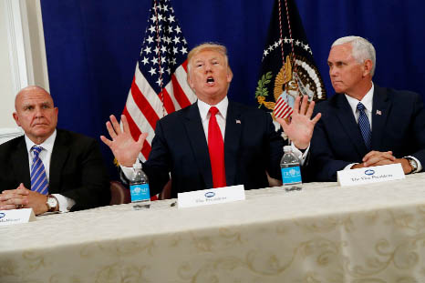 President Donald Trump, accompanied by Vice President Mike Pence, speaks to reporters before a security briefing at Trump National Golf Club in Bedminster, N.J.