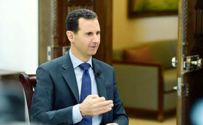 Syria's President Bashar al-Assad speaks during an interview with RIA Novosti and Sputnik.