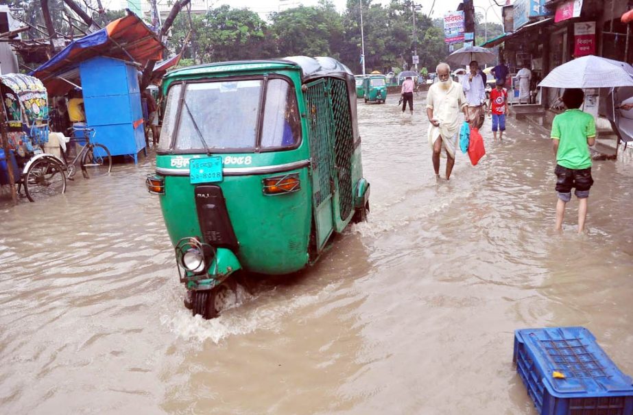 Most of roads in the Port city were went under water due to continuous rainfall for two days. This picture was taken from Katalganj area on Saturday.