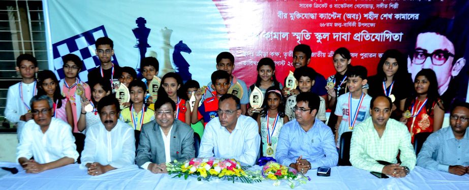 The winners of the Sheikh Kamal Memorial School Chess Competition and the guests and officials of Bangladesh Chess Federation pose for a photo session at Bangladesh Chess Federation hall-room on Sunday.
