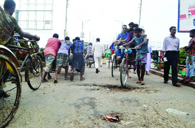 SYLHET: Vehicles and people are facing difficulty as crack have been developed on King-bridge Road. This snap was taken yesterday.