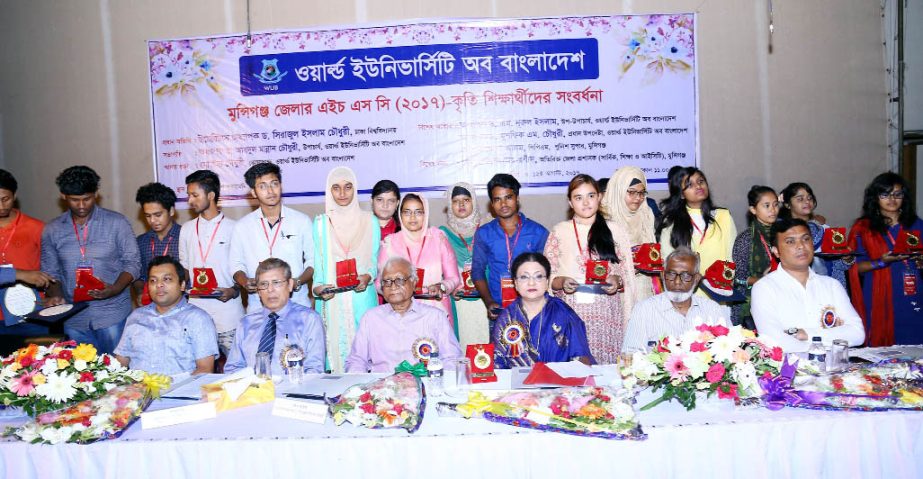 Sirajul Islam Chowdhury, Emeritus Professor of Dhaka University is seen with meritorious students of Munshiganj District at a reception program arranged by World University of Bangladesh on Saturday.
