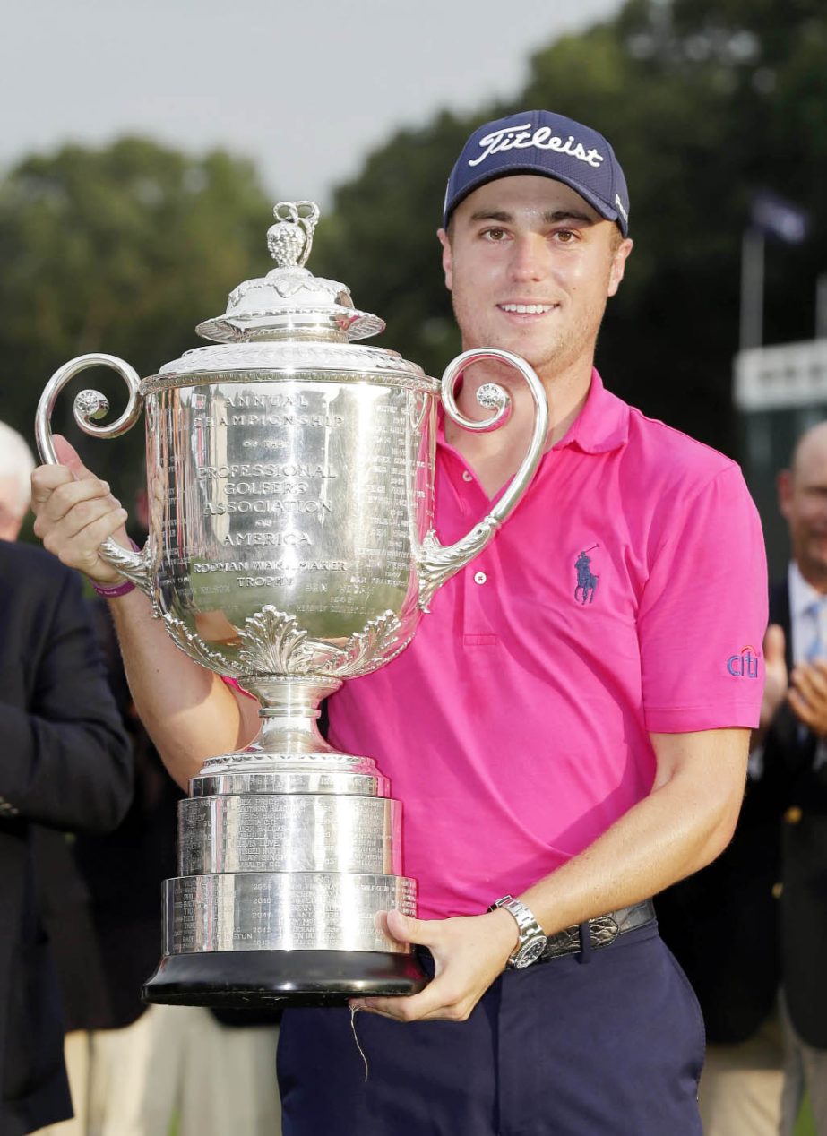 Justin Thomas poses with the Wanamaker Trophy after winning the PGA Championship golf tournament at the Quail Hollow Club in Charlotte, N.C on Sunday.