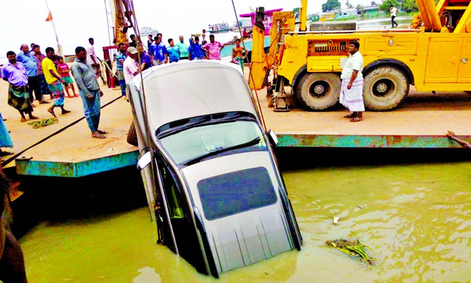 A jeep fell down into the Padma river as the pontoon of 3 No. ferryghat of Paturia was displaced due to strong tide of the river. The snap was taken on Monday.
