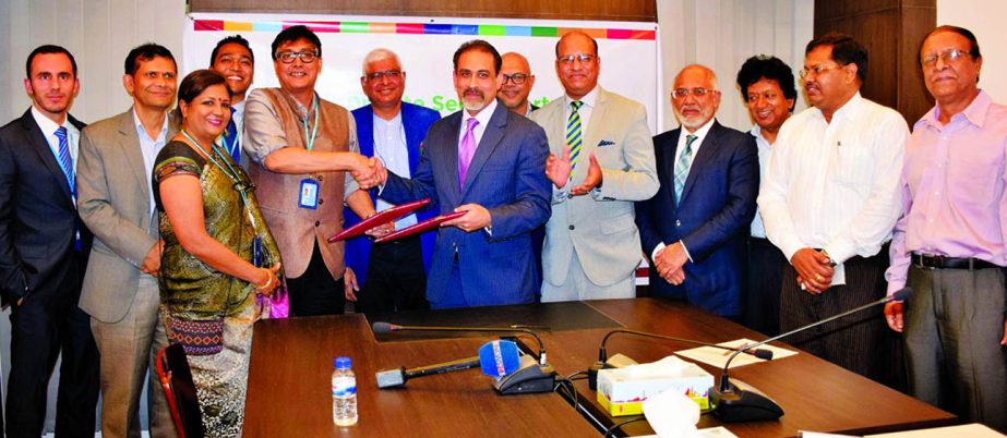 Sudipto Mukherjee, Country Director of UNDP Bangladesh and Abul Kasem Khan, President of DCCI exchanging a MoU signing documents to launch a project which will facilitate larger involvement of the Private Sector in development initiatives for boosting cor