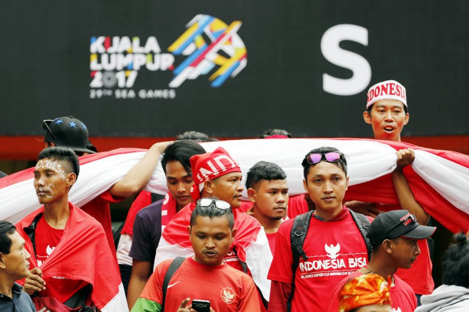Indonesian fans entering to stadium before the soccer match between Indonesia and Thailand during South East Asian Games in Shah Alam, Malaysia on Tuesday.