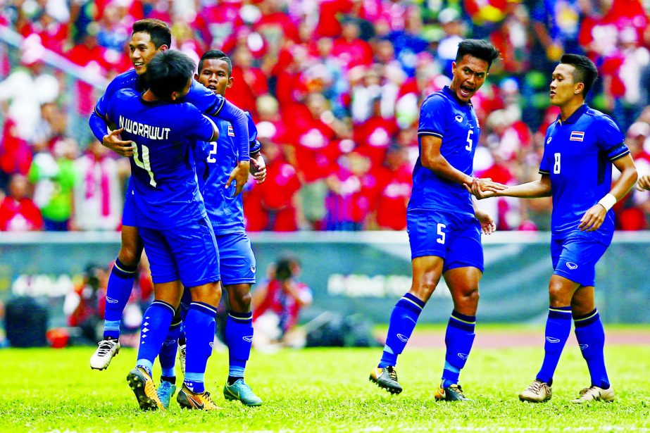 Thailand's Chaiyawat Buran (left) celebrates after scoring a goal against Indonesia during the soccer match at the South East Asian Games in Shah Alam, Malaysia on Tuesday.