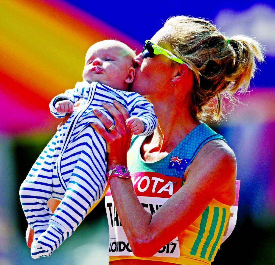 Australia's Claire Tallent kisses her 12-weeks-old son Harvey after finishing the women's 20-kilometer race walk during the World Athletics Championships in London on Sunday.