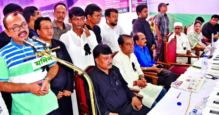 President of Bangladesh Awami Swechhasebak League Adv Mollah Md Abu Kausar speaking as Chief Guest at a discussion meeting on the occasion of National Mourning Day organised by Motijheel Thana Unit of the organization at Culvert Road in the city yesterd