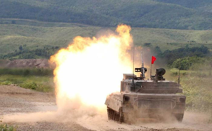 A Japan Ground Self Defense Force's Type 90 tank fires during their joint exercise, named Northern Viper 17, with U.S. Marine Corps at Hokudaien exercise area in Eniwa, on the northern island of Hokkaido, Japan on Wednesday.