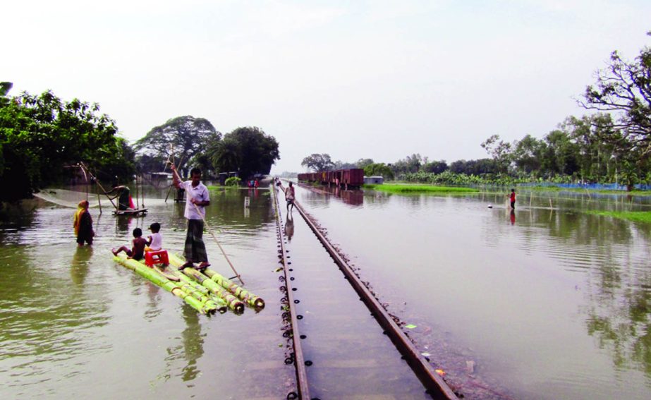 MELANDAH (Jamalpur): Train movement at Durmuth Rail Station in Melandah Upazila was stopped as the station and rail lines have gone under flood water . This snap was taken yesterday.