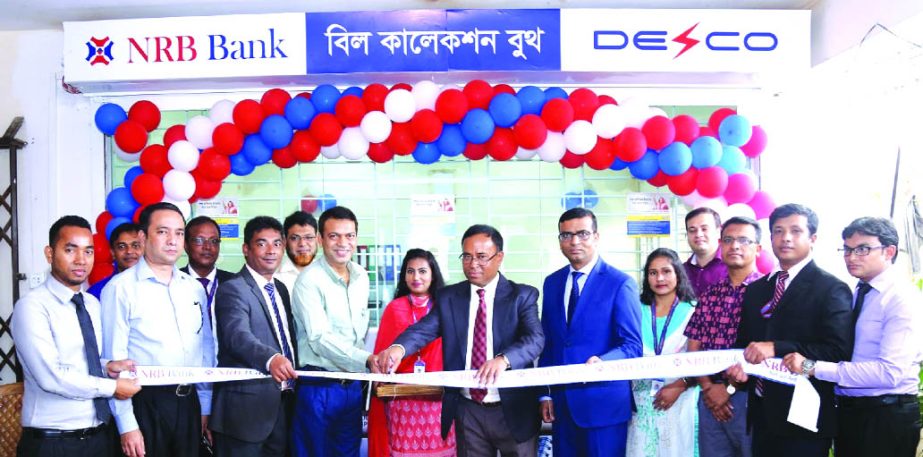 A K M Kamal Uddin, Head of Corporate Banking of NRB Bank Limited, inaugurating a bill collection booth of Dhaka Electric Supply Company Limited at cityâ€™s Uttarkhan recently Md. Masudur Rahman Khan Deputy General Manager (Finance) of DESCO, Eng. Md