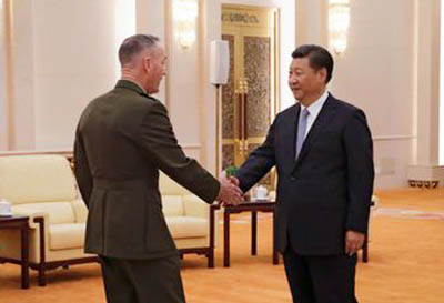 U.S. Chairman of the Joint Chiefs of Staff Gen. Joseph Dunford shakes hands with President Xi Jinping at the Great Hall of the People in Beijing, China on Thursday.