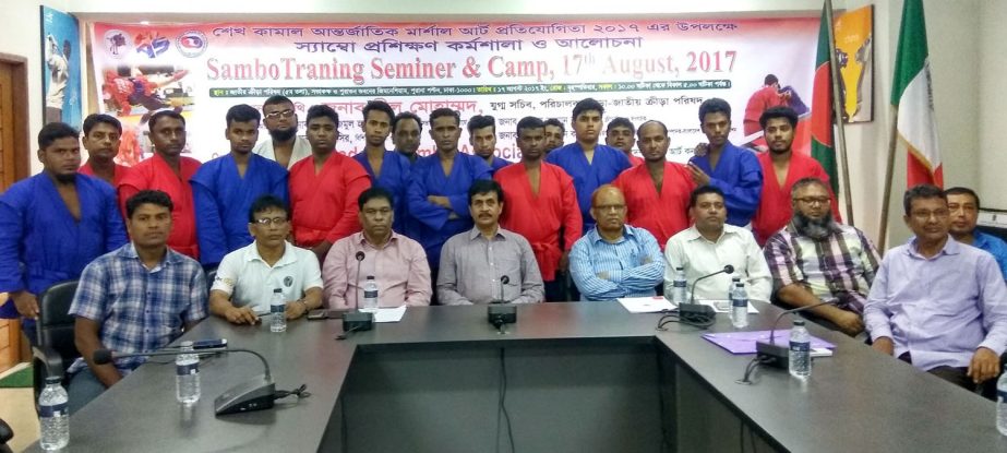 The participants of the seminar on the Sambo Martial Art and the officials of National Sports Council and the officials of Bangladesh Sambo Association pose for a photo session at the conference room of National Sports Council Tower on Thursday.