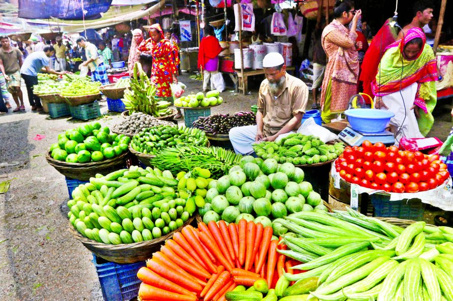 Vegetablesâ€™ price in sky-rocketing due to fresh flood across the country. This photo was taken from Fakirerpool market on Thursday.