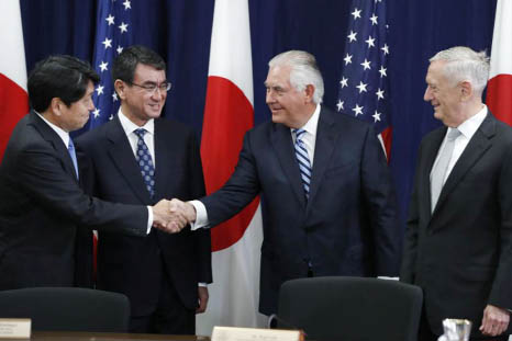 Japanese Defense Minister Itsunori Onodera, (left) next to Japanese Foreign Minister Taro Kono, shakes hands with Secretary of State Rex Tillerson, next to Defense Secretary James Mattis:.