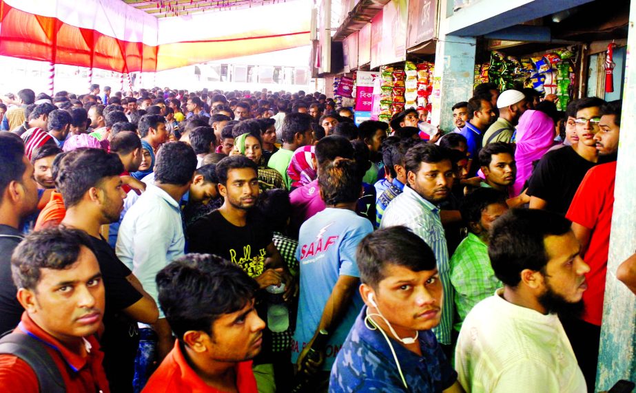 Thousands of people thronged the Gabtali bus terminal counter to buy Eid-ul-Azha advance tickets started to sale yesterday.