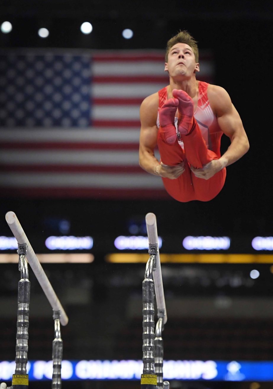 Alex Yoder competes on the parallel bars during men's opening round of the U.S. gymnastics championships on Thursday.