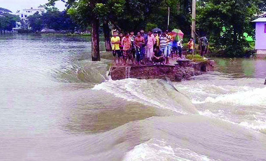Flood protection dam in different areas of Rajbari-Gaibandha washed away as Padma River still flowing above danger level. Thousands of people marooned due to erosion. This photo was taken on Saturday.