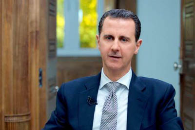Syria's President Bashar al-Assad speaks newsmen in Damascus, Syria.