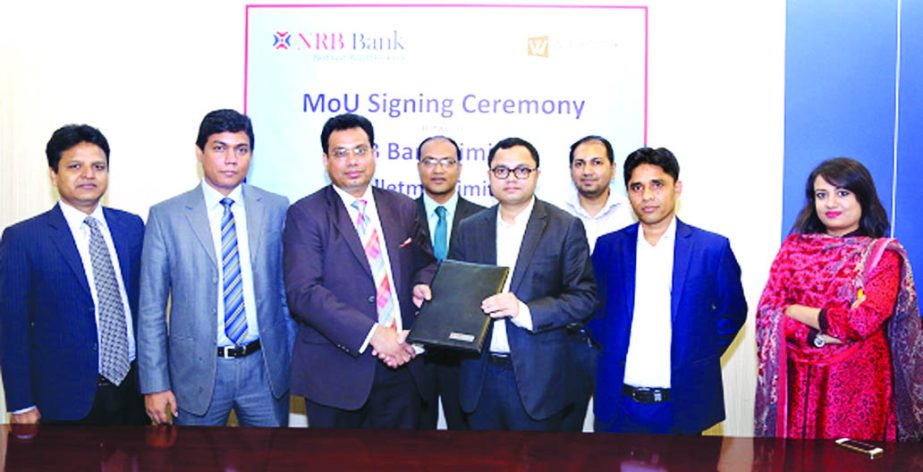 Imran Ahmed, Chief Operating Officer of NRB Bank Limited and Md. Humayun Kabir, CEO of Walletmix Limited, exchanging agreement signing documents at the bank's corporate head office in the city recently. Under the deal, Credit Cardholders of the bank will