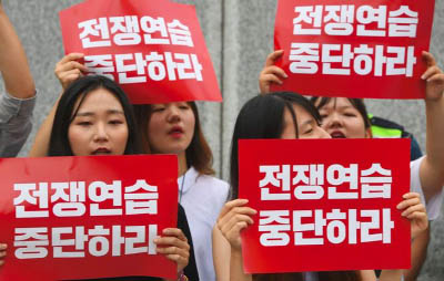 South Korean protesters held up placards reading "Stop war exercise"" near the US embassy in Seoul on Monday"