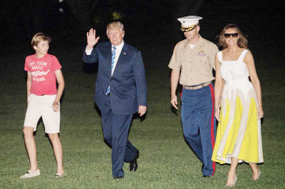 President Donald Trump, with First Lady Melania Trump and son Barron, returned to the White House on Sunday night after a 17-day "working vacation"