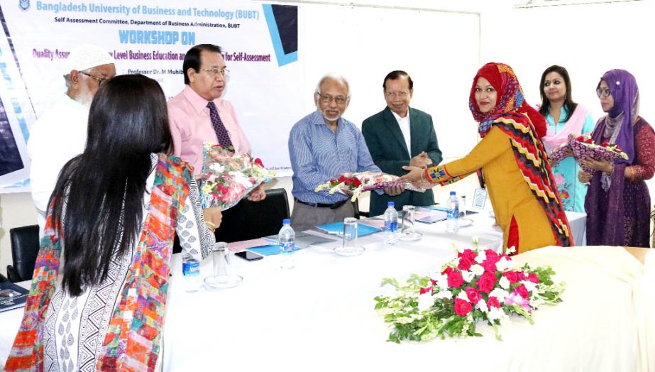 Prof Dr M. Muhibur Rahman, former member of UGC distributing certificates among the participants of a daylong workshop on quality assurance in tertiary level business education organized by Bangladesh University of Business and Technology at its Campus-2,