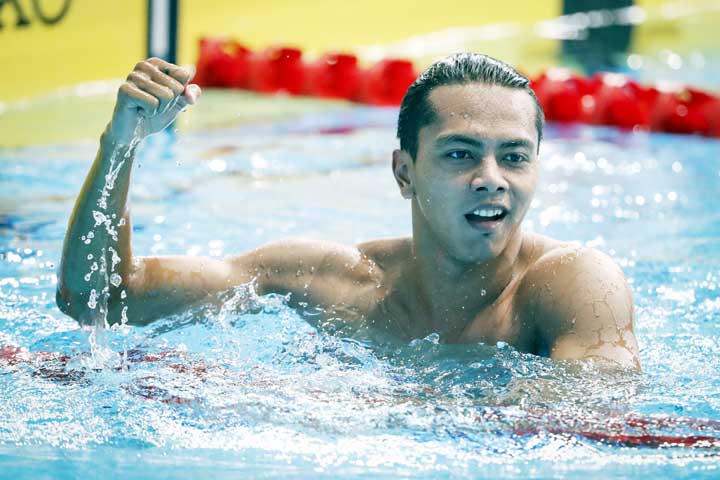 Indonesia's Gede Siman Sudartawa celebrates after winning the Men's 50M Backstroke Swimming final of the 29th South East Asian Games in Kuala Lumpur, Malaysia on Monday.