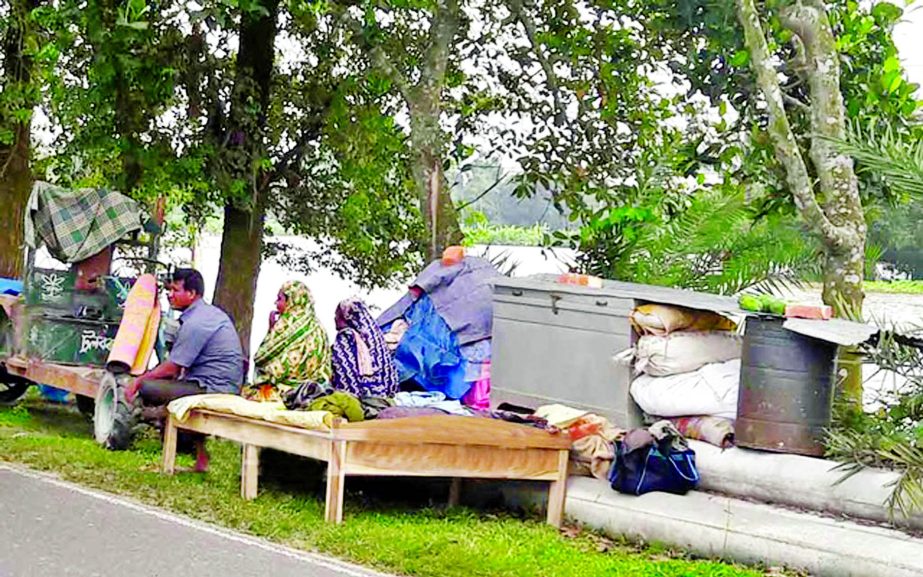 Flood affected families passing their days in miseries under the open sky as their houses were submerged by the rain and hilly water. This photo was taken from Kurigram area on Wednesday.