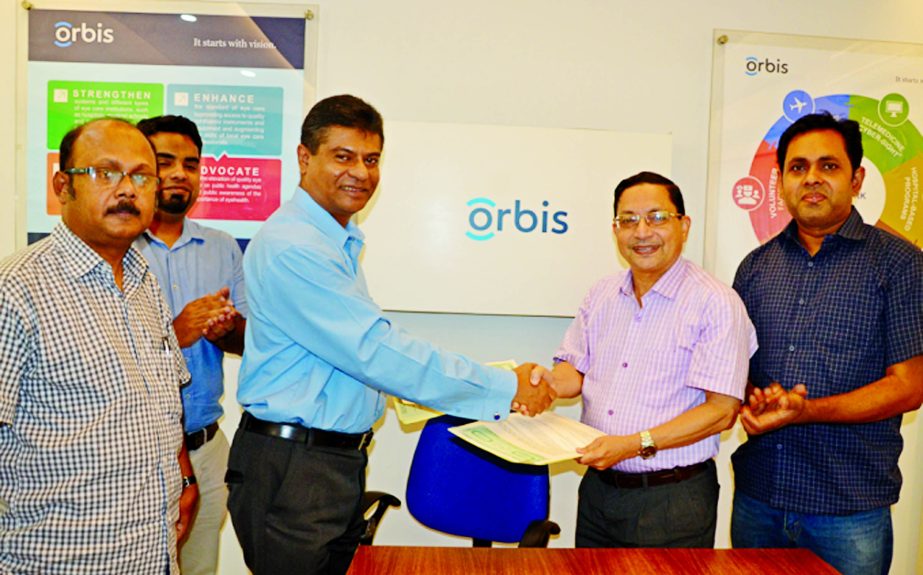 Dr. Munir Ahamed, Country Director of ORBIS Int. Bangladesh (2nd from the left) and Md. Manzur Jalil Group Manager Irving Group exchanging MoU documents for 10th Flying Eye Hospital Programme at a city auditorium recently.