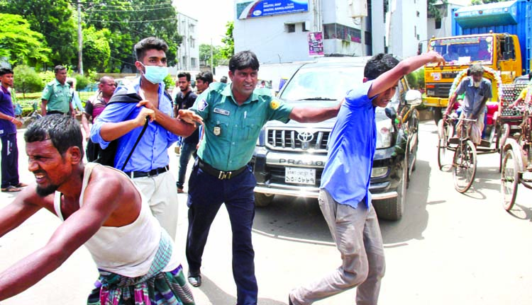Law enforcers nabbed some students of the city's Biggyan College from 'Satrasta' intersection, Tejgaon on Thursday when they engaged in vandalizing a bus centering bus fare.