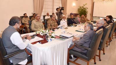 Pakistan's Prime Minister Shahid Khaqan Abbasi, (left), heads a meeting of the National Security Committee in Islamabad, Pakistan on Thursday.