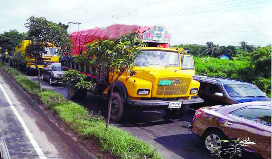 A massive traffic snarl from Gouripur to Madanpur in Daudkandi was witnessed due to accidents and weight scaling of vehicles at Meghna Toll Plaza. The snap was taken on Friday.