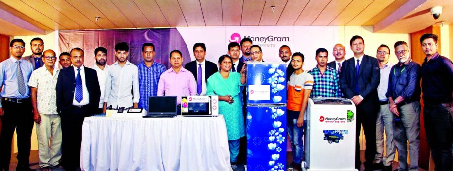 Sheshagiri Malliah (Sukesh), MoneyGram's Head of India and Subcontinent, poses with the winner of 'Ramadan Celebrations Special," programme at a city centre on Thursday. All Agent Banks of MoneyGram and 30 winners of the programme were also present.