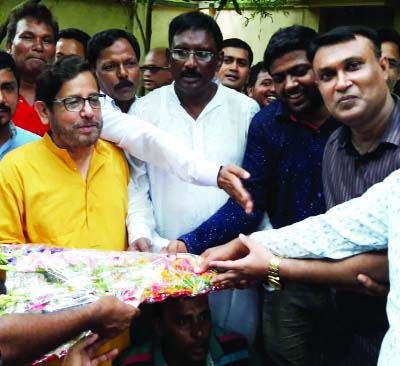 SYEDPUR(Nilphamari):Cultural Affairs Minister Asaduzzaman Noor exchanging greetings with the newly-elected members of Executive Council of District Sports Association, Nilphamari on Thursday.